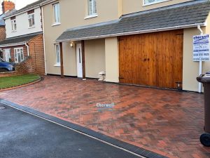 Brindle and Charcoal Block Paved Driveway with Roll-On Turf in Banbury