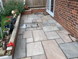 Indian Sandstone Patio with Retaining Wall in Banbury