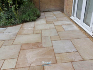 Indian Sandstone Patio with Sleeper Retainers in Banbury