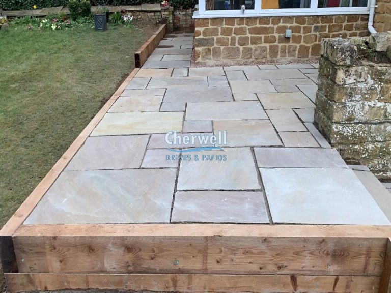 Indian Sandstone Patio with Steps and Retaining Wall in Mollington