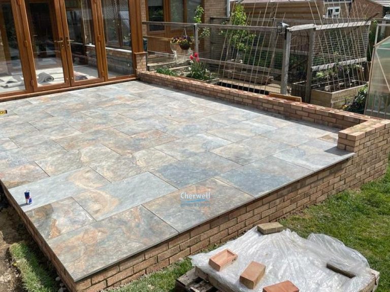 Porcelain Tiled Raised Patio with Retaining Wall in Brackley